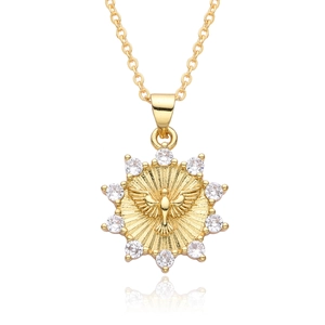 Golden sun medallion necklace with peace dove engraving and sparkling white crystals