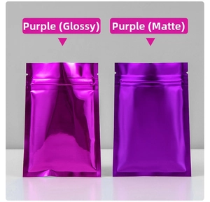 Detail of purple foil pouches showing glossy and matte finishes with resealable zippers