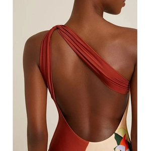 Detail of one-shoulder floral printed bodysuit with elegant open back and draped shoulder