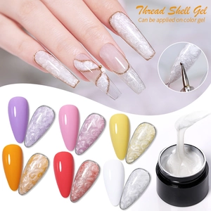 Thread shell nail gel with 3D pearl texture effects over various colorful base coats