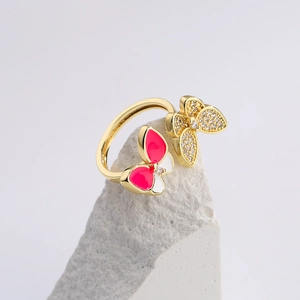 18K gold butterfly open ring with pink enamel and zircons on white stone block