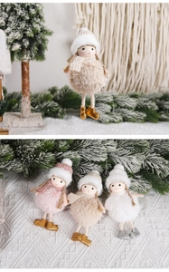 Detailed view of plush Christmas angel ornaments in pink, beige, and white with faux fur balls