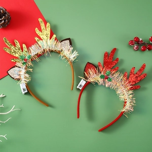 Detail of LED Christmas reindeer antlers headbands with sequin and tinsel decor