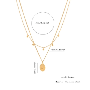 Detail showing dual-layer stainless steel gold necklace with coin pendant and small discs