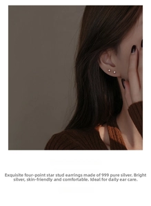 Detailed view of s999 sterling silver four-pointed star stud earrings on model's ear