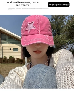 Close-up of pink distressed baseball cap with sequin star patch and rough stitching details