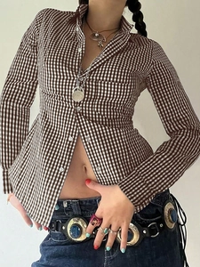 Detail of a brown and white plaid long sleeve button-up shirt in retro Y2K style