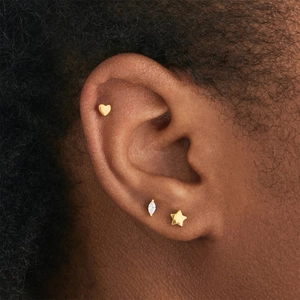 Detail of three-piece S925 silver earring set with heart, star and marquise crystal stud