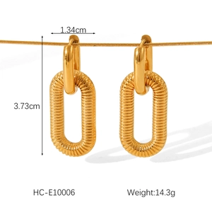 Detailed view of gold textured oval hoop earrings with size 3.73cm and weight specs