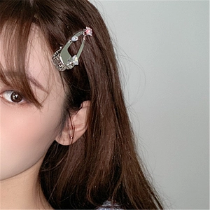 Close-up of elegant zircon duckbill hair clip worn on a model side view for luxury style