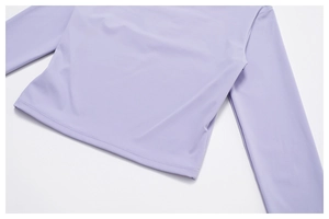 Detail shot of the lavender yoga shirt showing high-quality double-needle hem stitching