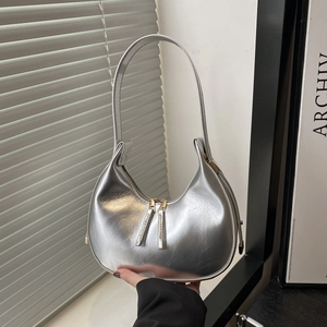 Silver metallic hobo bag with double zipper and half-moon design for modern women