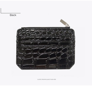 Rear view of black crocodile pattern card holder with multiple slots and top zipper closure