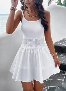 Detail of white A-line mini dress with elastic waist pleats for summer vacation beach look