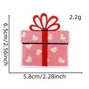 Pink heart gift box embroidery patch showing 6.5x5.8cm size measurements and weight