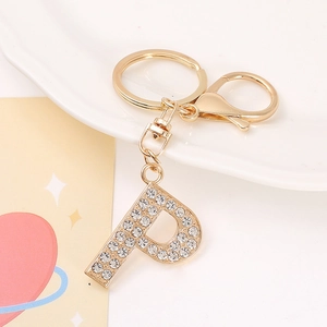Detail of gold-plated letter P keychain with sparkling crystal rhinestones and lobster clasp