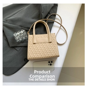Detail of apricot crossbody bag with quilted texture and matching handle on a blazer