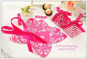 Pink wedding candy box with thank you tag, magenta ribbon and white cherry blossom patterns