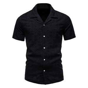 Detail of black summer shirt featuring geometric triangle texture and white contrast buttons