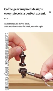 Detail view of coffee tamper and portafilter keychains in a polished mirror black finish