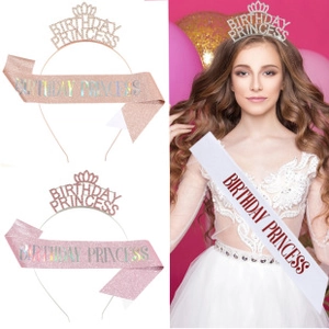 Detail of rose gold birthday crown and princess sash on white and pink background