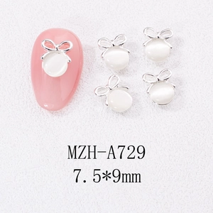 Détail de bijoux d'ongles en alliage en forme de nœud avec pierre œil de chat, 7.5x9mm