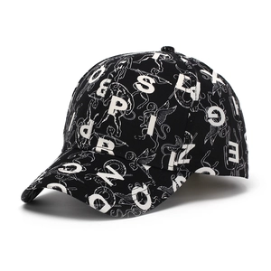 Close-up of black baseball cap with white all-over letter and angel graphic print