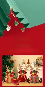 Close-up of burlap Christmas gift bags with reindeer antlers and festive bells
