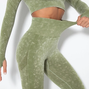 Detail of high-stretch acid wash seamless yoga pants with a wide ribbed waistband for fitness