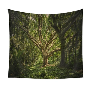Bohemian forest landscape tapestry featuring a large ancient tree on a white wall decor