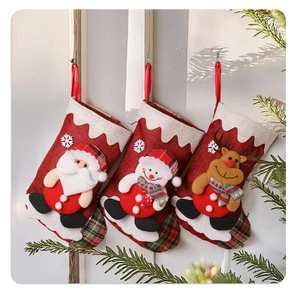 Three burlap Christmas stockings featuring 3D Santa, Snowman, and Reindeer figurines
