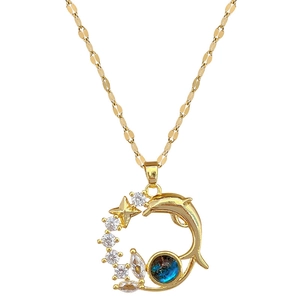 Golden dolphin necklace with sparkling zircon stars and a shimmering teal round gemstone