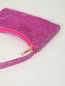 Detailed close-up of pink rhinestone mesh evening bag with premium gold zipper hardware