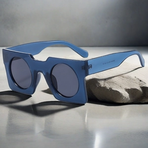 Detail view of square blue translucent frame sunglasses with model number ZN3940 engraving