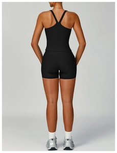 Back view of black ribbed yoga set featuring racerback tank top and high waist shorts