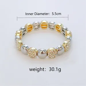 Close-up of mixed gold and silver beaded bracelet with cubic zirconia inlay and 5.5cm diameter