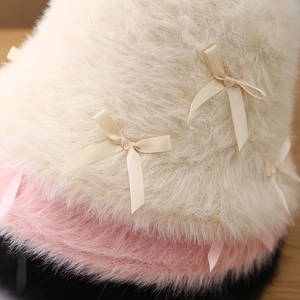 Sweet fuzzy bucket hat for women with plush faux fur and a small decorative bow detail