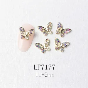 Detail of 3D gold butterfly nail charm with zircon inlays and 11x9mm size display
