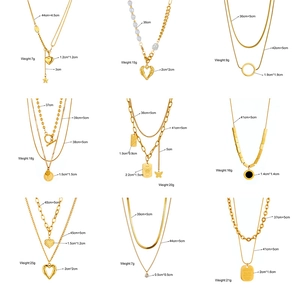 Multilayered gold necklaces with pearls, heart charms and asymmetric chain designs