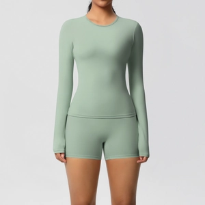 Close-up of mint green seamless long-sleeved top and high-waisted shorts set