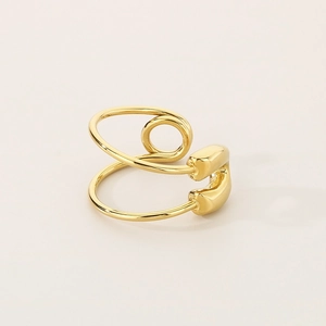 Detail view of the golden double-layer geometric open ring with polished metal finish