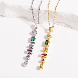 Detail of gold and silver hip-hop necklaces with colorful square geometric gem pendants
