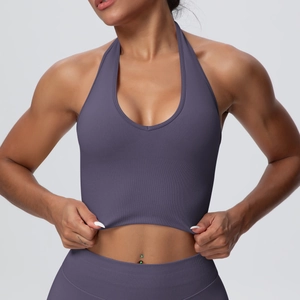 Detail of purple ribbed halter yoga top and high waist leggings in seamless knit fabric