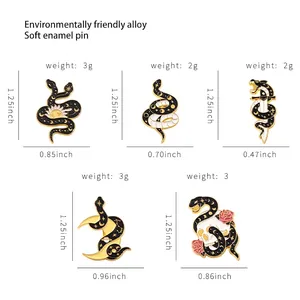 Size chart for dark style snake enamel pins with sun, moon, and skull gothic motifs