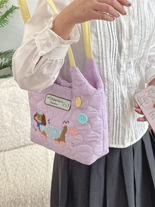 Quilted macaron purple tote bag with dog embroidery and yellow straps for school use