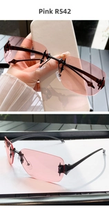 Detail of Y2K rimless sunglasses with pink transparent lenses and star metal accents