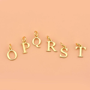 925 silver gold-plated O to T alphabet pendants for DIY jewelry making on pink background