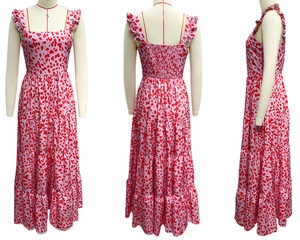 Detail view of pink bohemian maxi dress with red spots and smocked back panel