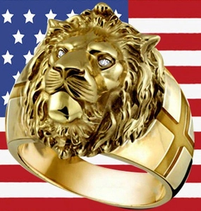 Detailed view of golden lion head ring featuring diamond eyes and cross engravings on the side
