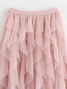 Detailed close-up of pink layered mesh tulle ruffles on this bohemian style A-line skirt